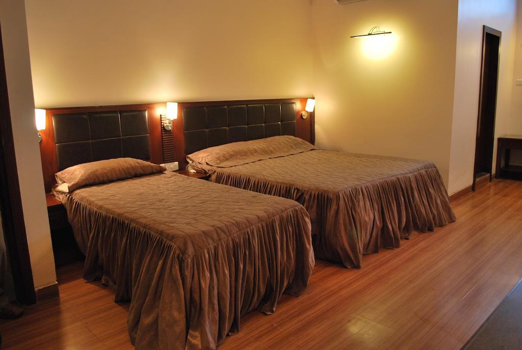 Hotel Millennium Guwahati Kamer foto